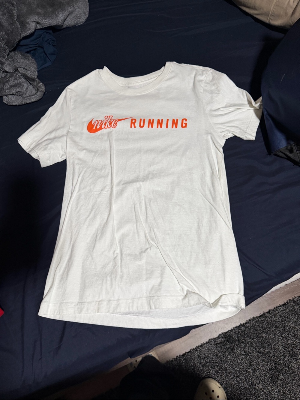 Nike White Short Sleeve Tee with Orange Running Graphic